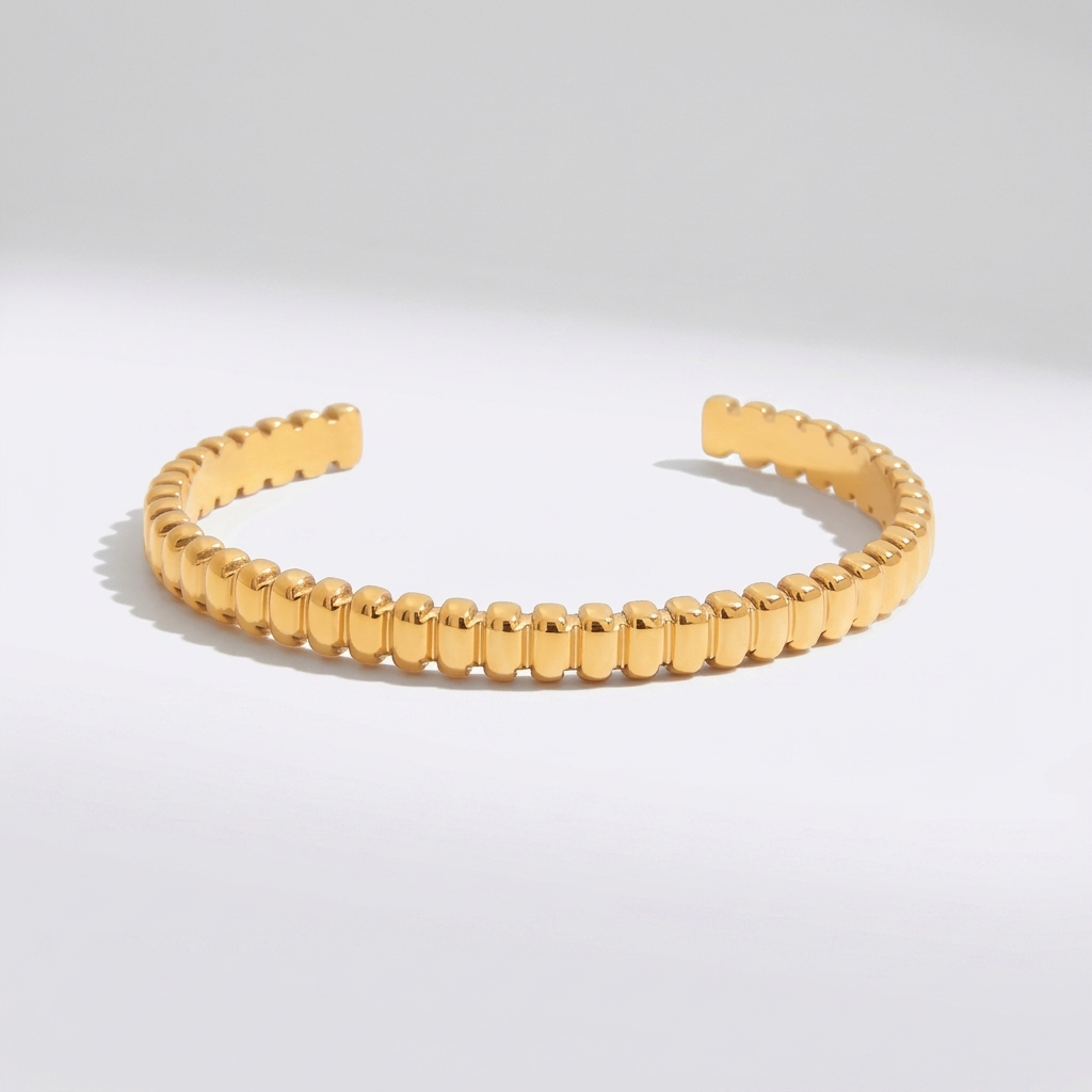 Emma Sculpted Gold Bangle with sparkling zircon details