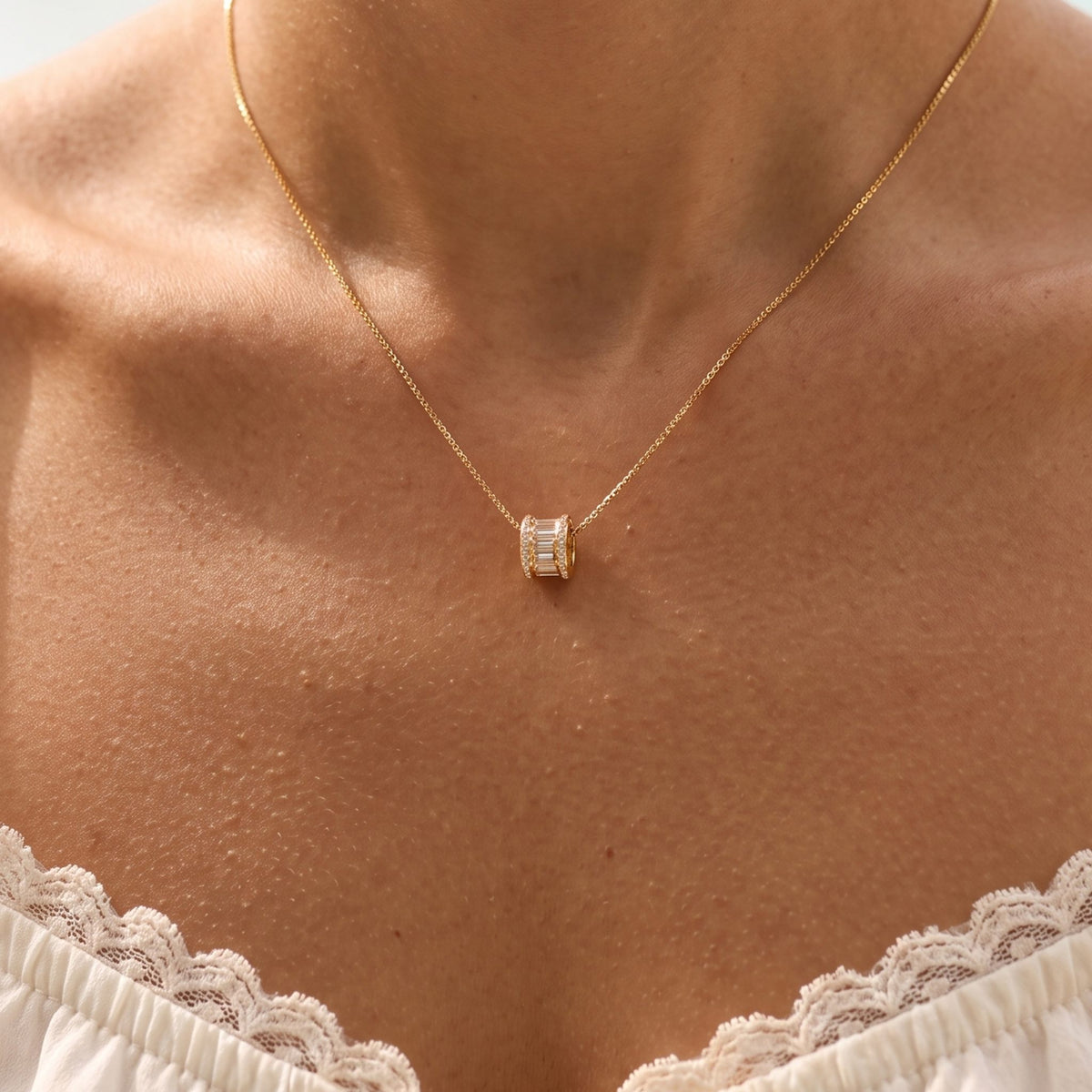 Close-up of the Baguette Slider Necklace worn on the neckline