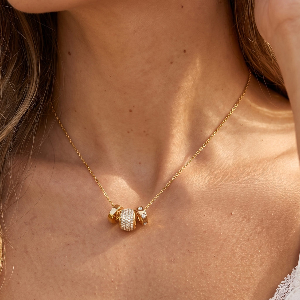 Close-up of the Barrel Charm Necklace at the collarbone, highlighting its sparkling pavé crystal embellishments