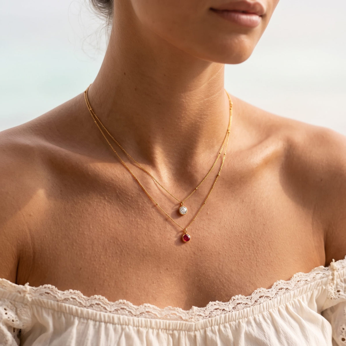 Wider view of a woman wearing the Birthstone Pendant