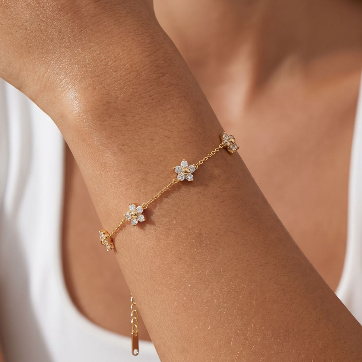 Blossom Chain Bracelet worn on the wrist, photographed in natural daylight.