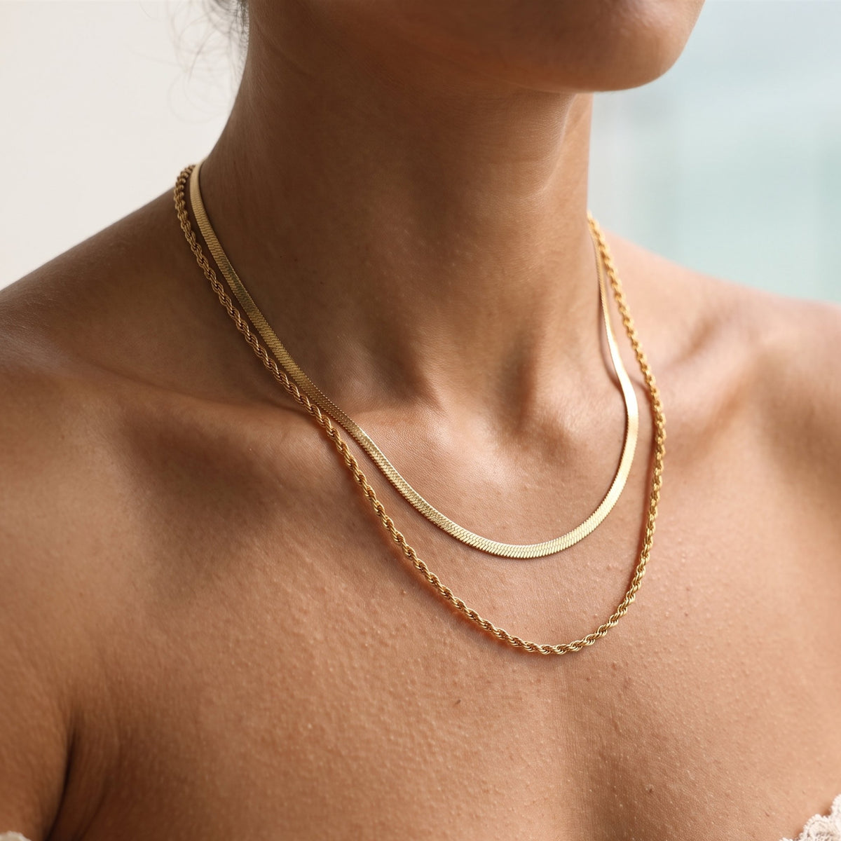 Close-up of the Cascata Necklace worn on the neckline