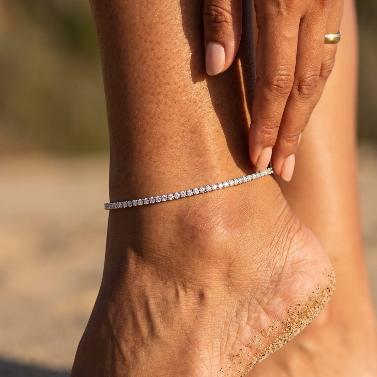 Close-up of the Dainty Tennis Anklet worn on the ankle