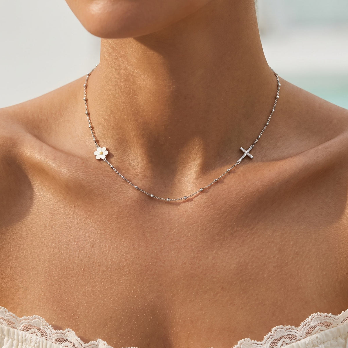 Close-up of the Daisy & Cross Necklace worn on the neckline