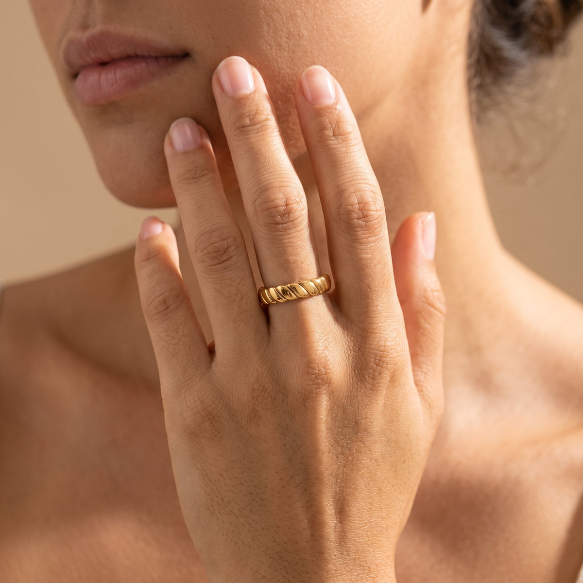 Wider view of a hand wearing the Dome Twist Ring