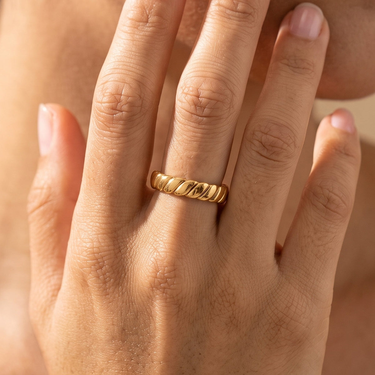 Close-up of the Dome Twist Ring worn on the finger