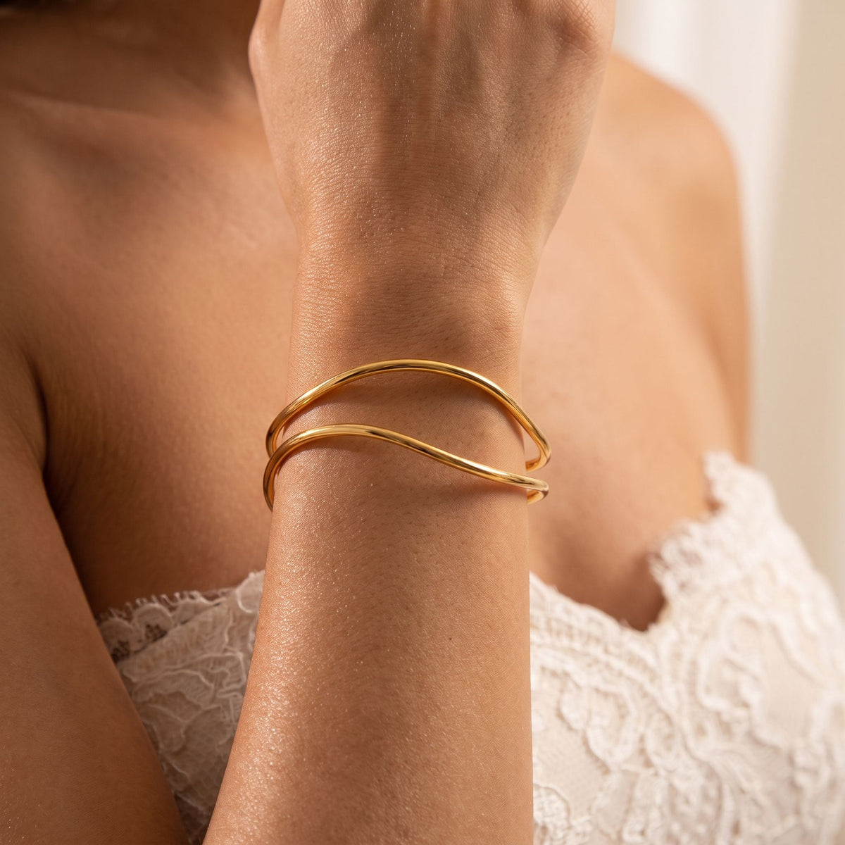Double Wire Cuff worn on the wrist, showing the open ends of the cuff.