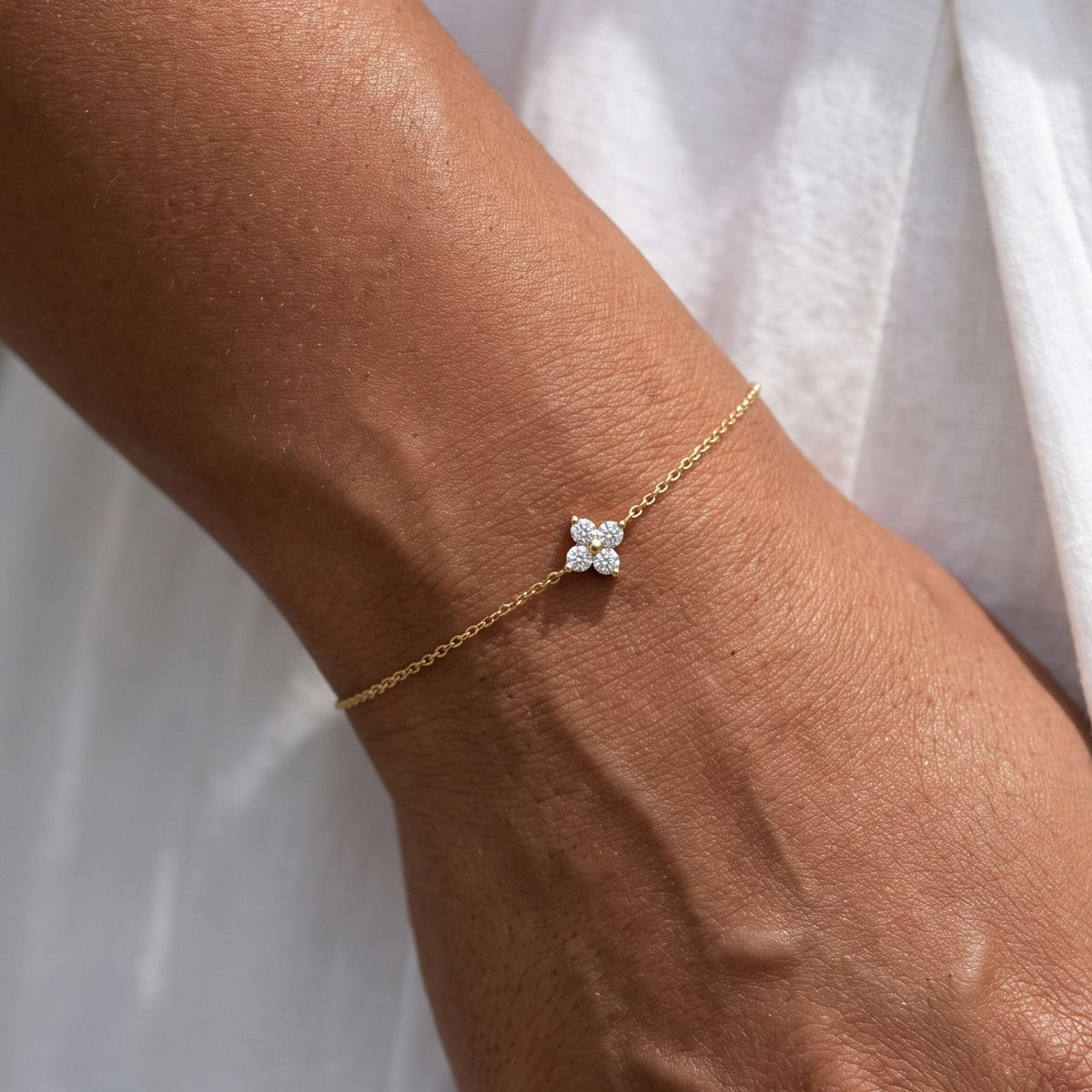 Four Petal Bracelet worn on the wrist, photographed in natural daylight.