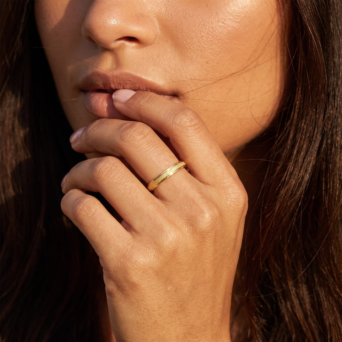 Wider view of a hand wearing the Frosted Gold Ring
