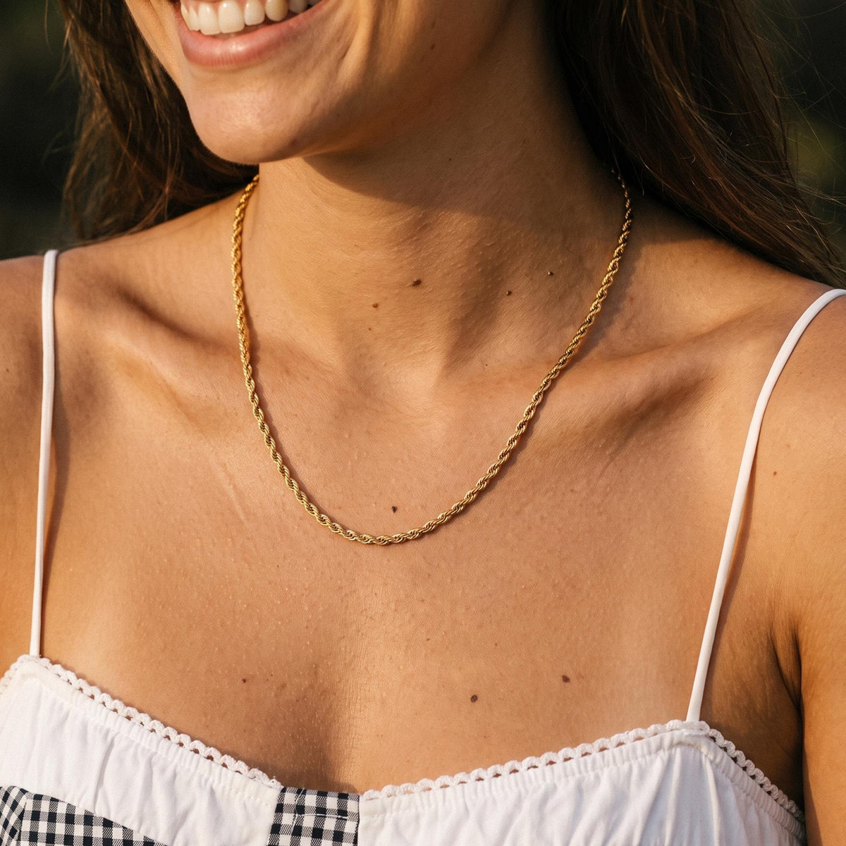 Close-up of the Gold Rope Necklace worn on the neckline