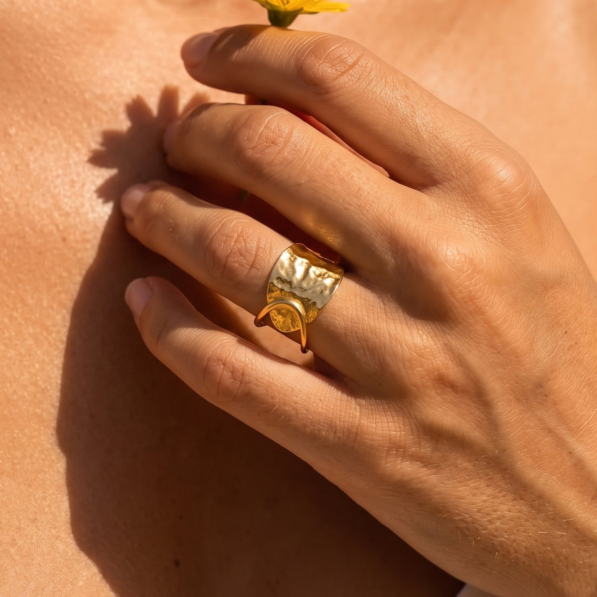 Close-up of the Hammered Plate Ring worn on the finger