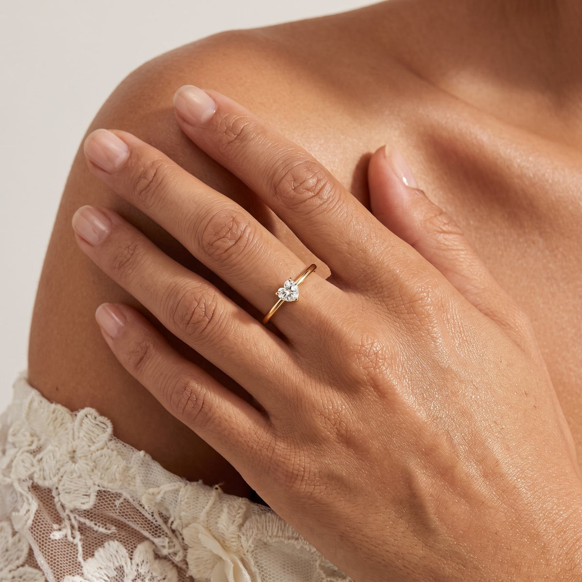 Wider view of a hand wearing the Heart Solitaire Ring
