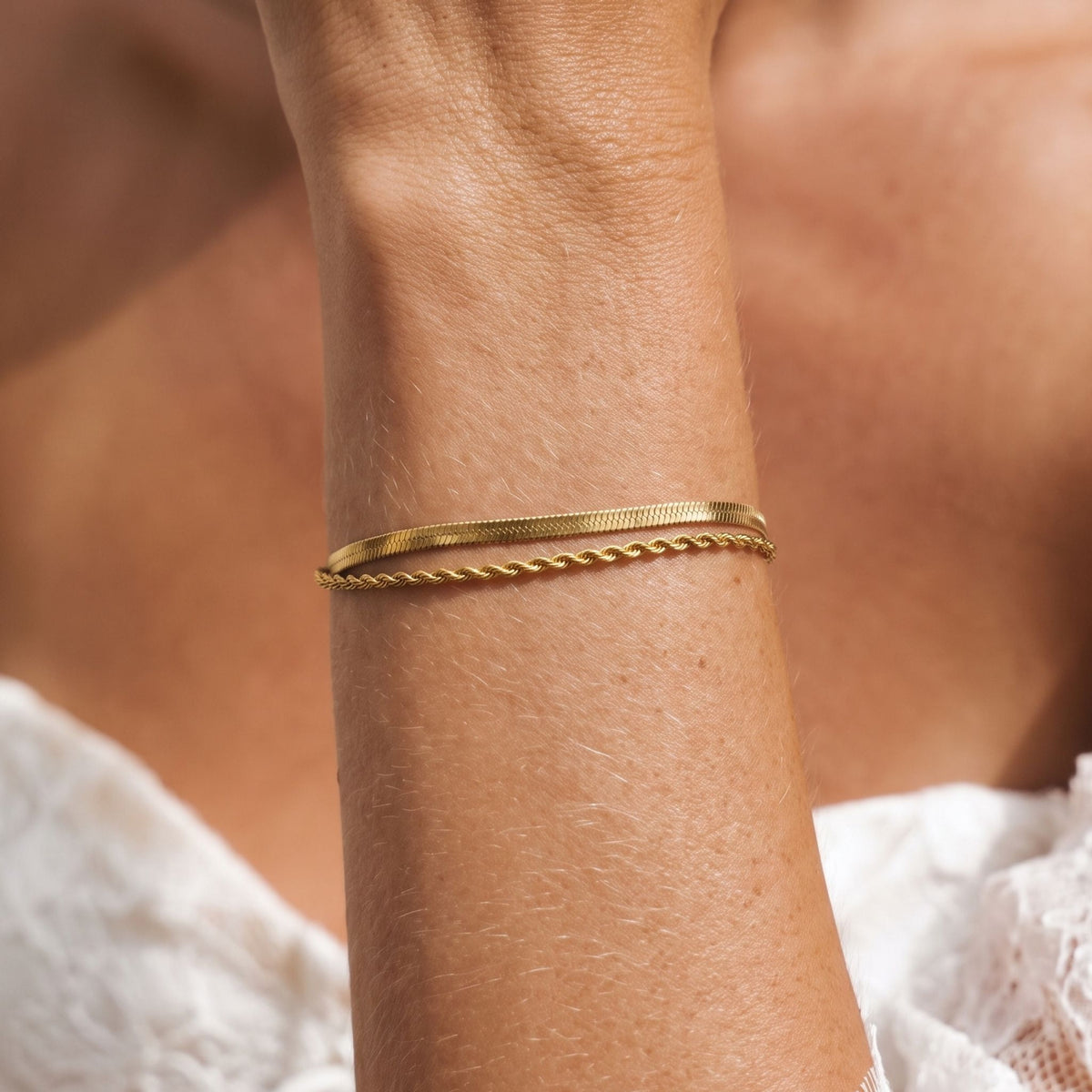 Herringbone Rope Bracelet worn on the wrist, photographed in natural daylight.