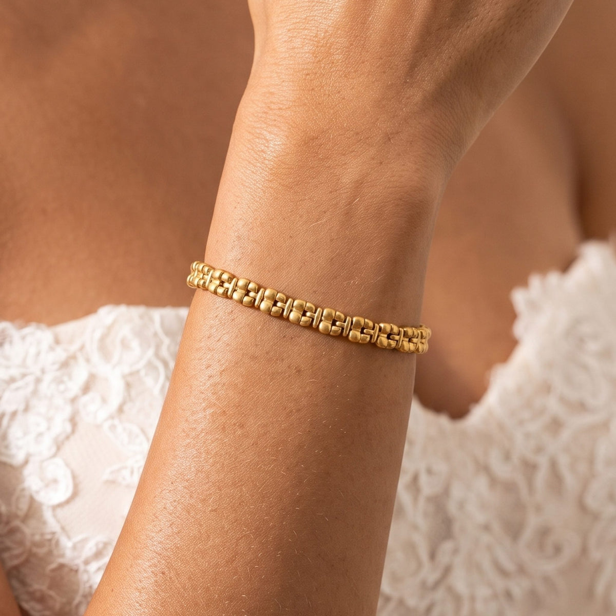Close-up of the Jubilee Link Bracelet on the wrist showing its intricate gold link pattern