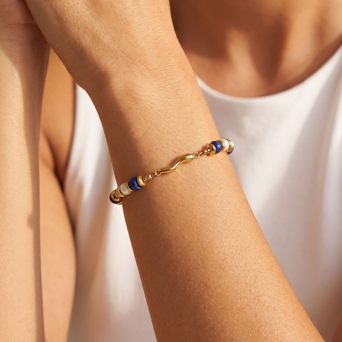 Lapis Bead Bracelet worn on the wrist, photographed in natural daylight.