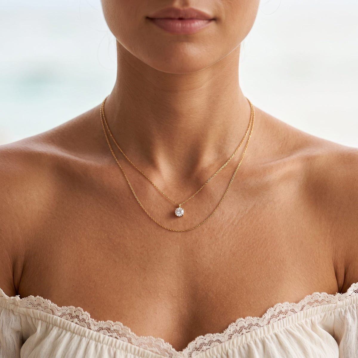 Wider view of a woman wearing the Layered Solitaire Necklace