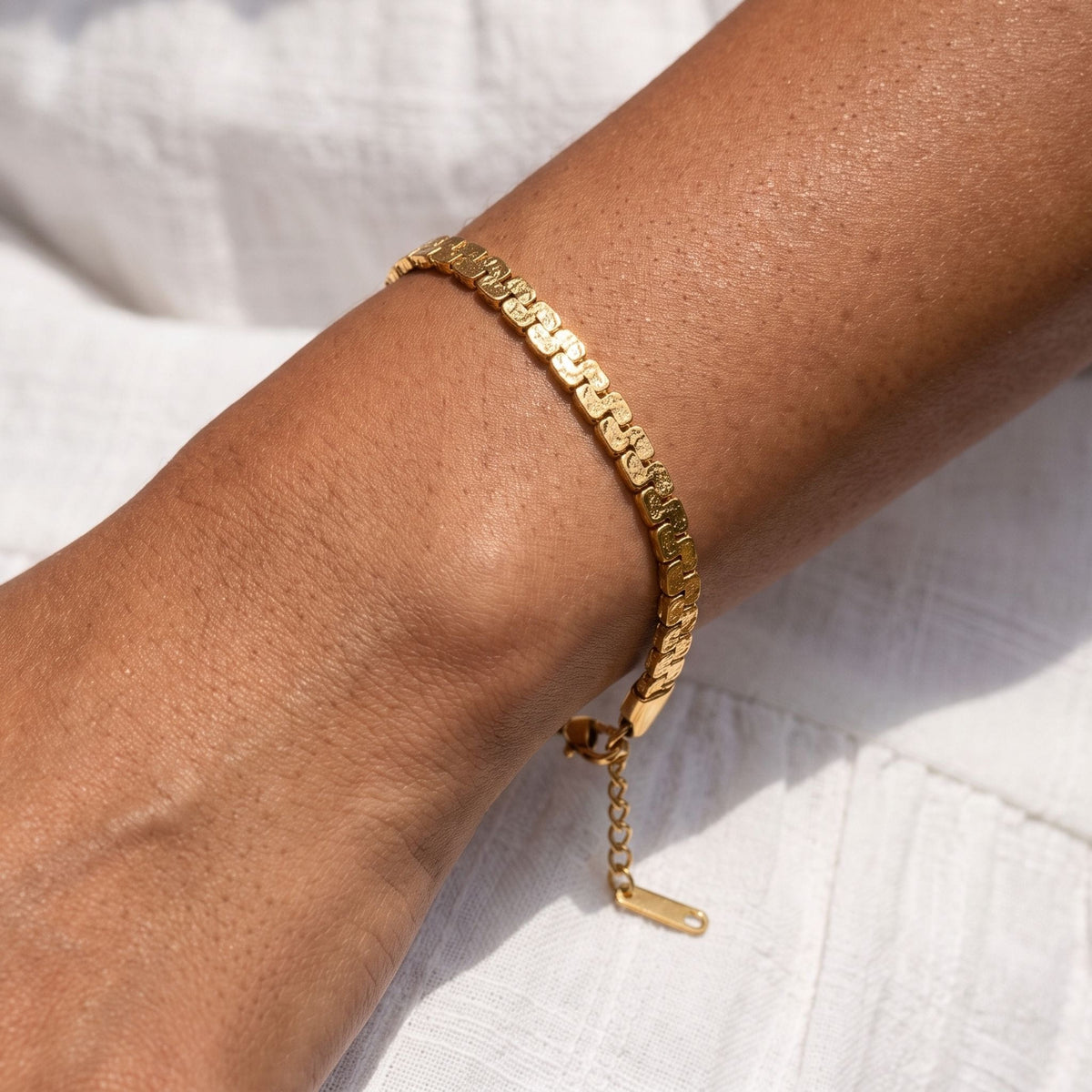 Mariner Link Bracelet worn on the wrist, photographed in natural daylight.