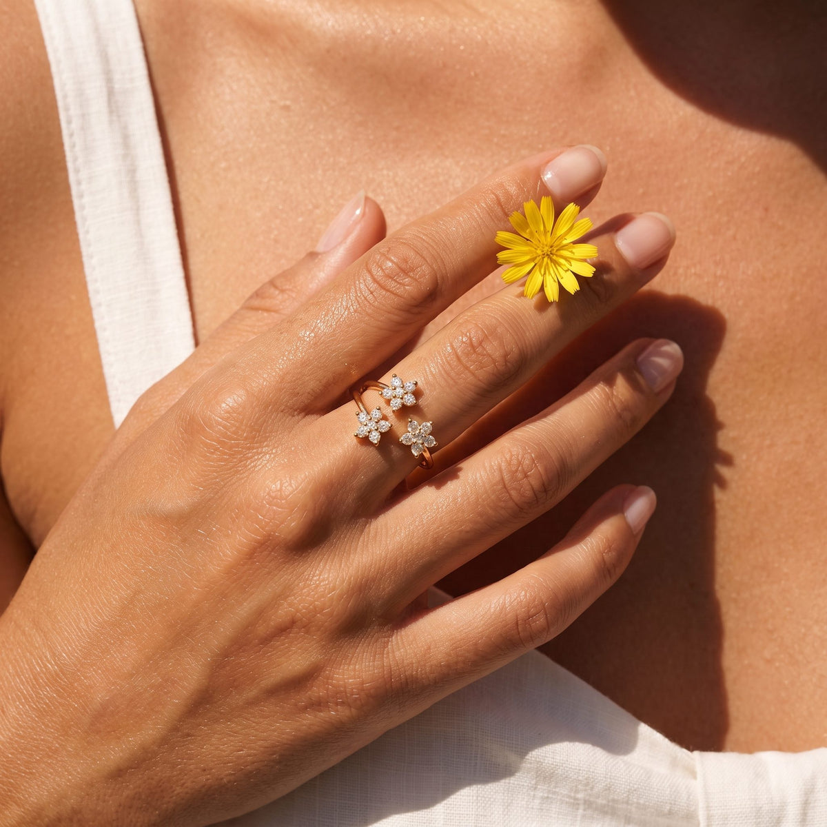 Wider view of a hand wearing the Marquise Bloom Ring