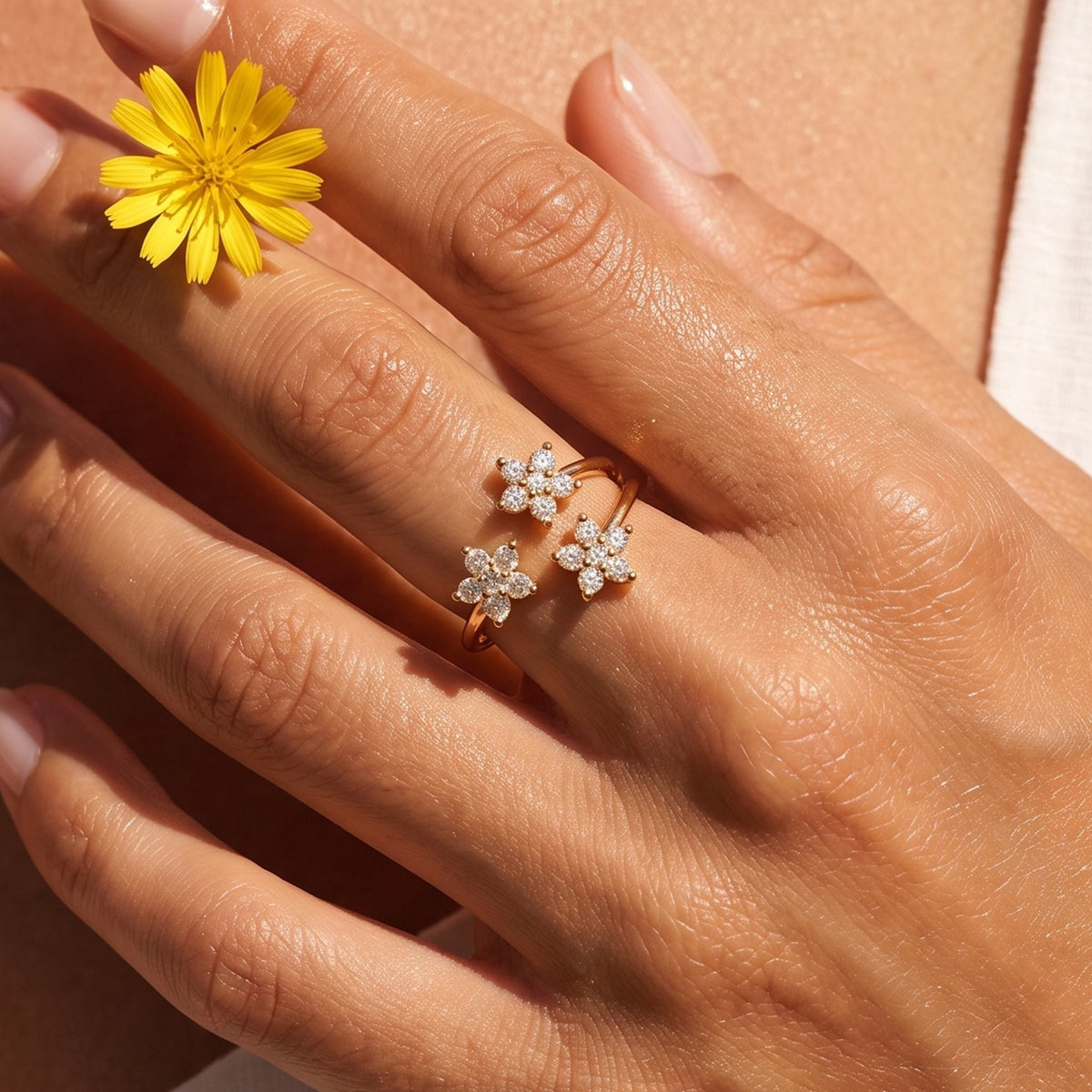 Close-up of the Marquise Bloom Ring worn on the finger