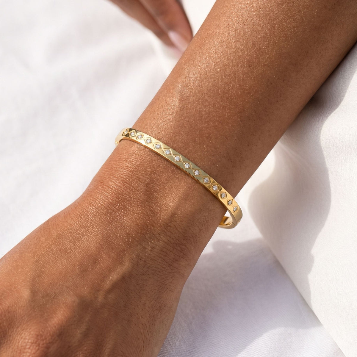 Marquise Set Bangle worn on the wrist, photographed in natural daylight.
