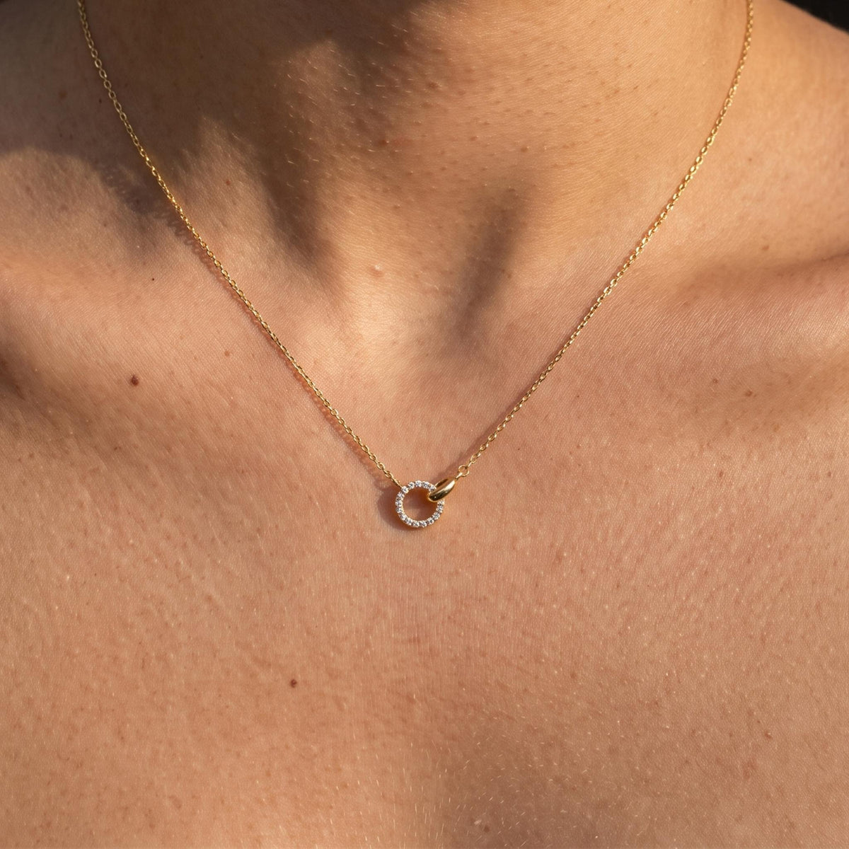 Close-up of the Mini Link Pendant worn on the neckline