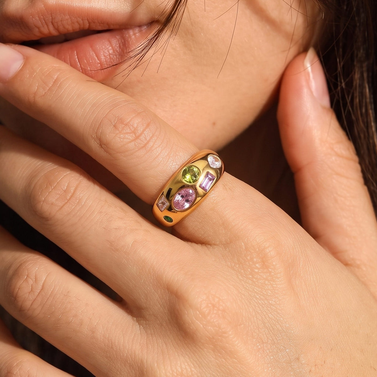 Close-up of the Multicolour Dome Ring on her ring finger, showcasing embedded colorful crystals