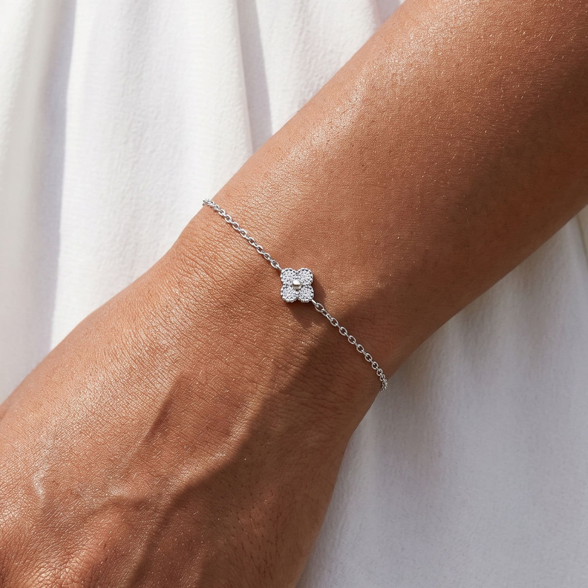 Pavé Clover Bracelet worn on the wrist, photographed in natural daylight.