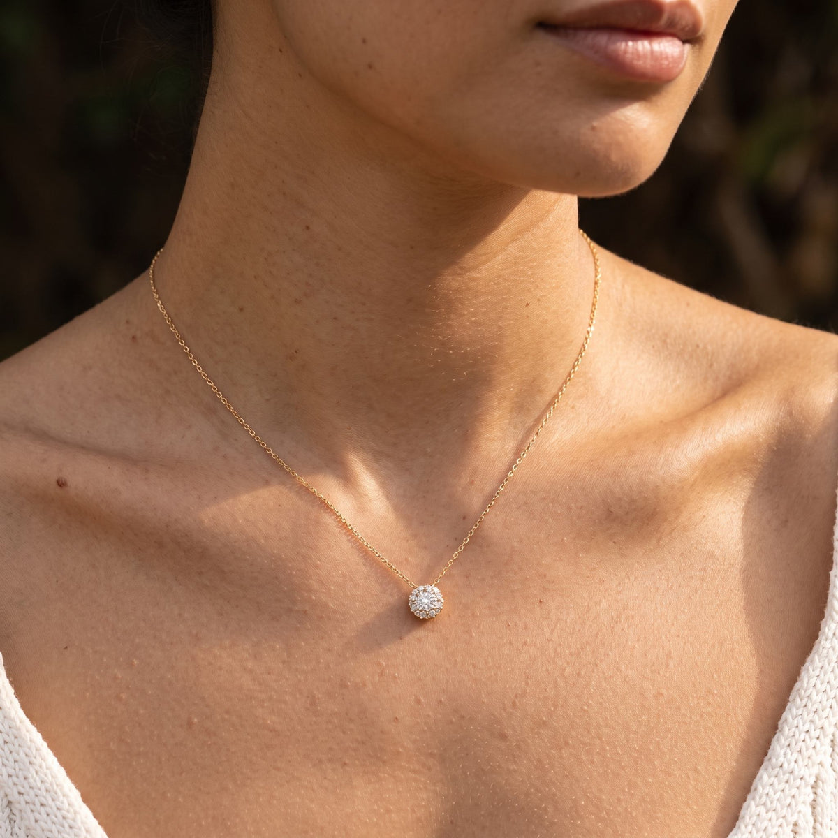 Wider view of a woman wearing the Pavé Dome Pendant