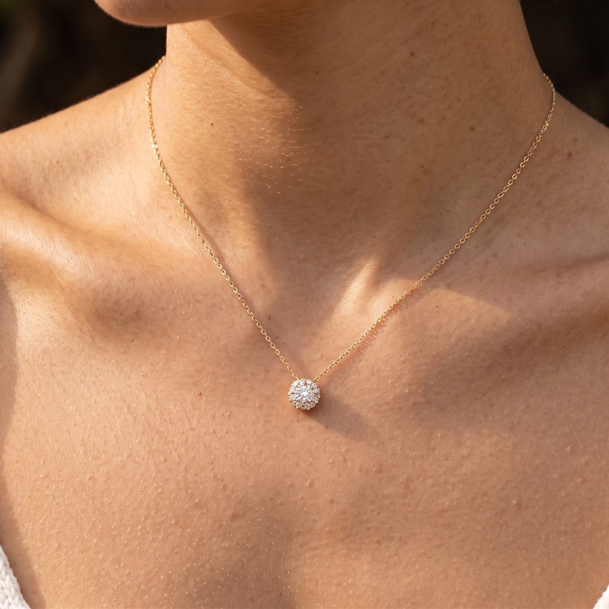 Close-up of the Pavé Dome Pendant worn on the neckline