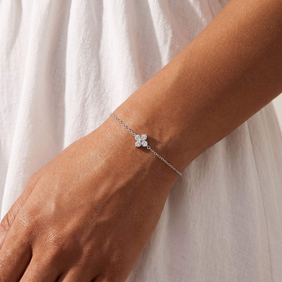 Pear Clover Bracelet worn on the wrist, photographed in natural daylight.