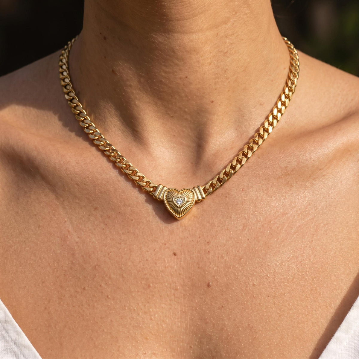 Close-up of the Ridged Heart Necklace worn on the neckline