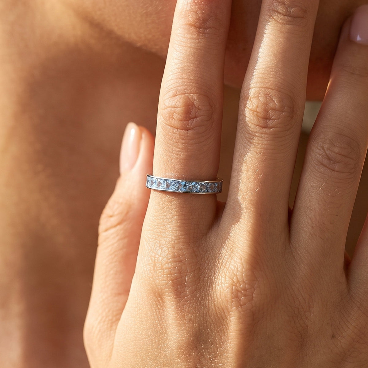 Close-up of the Square Channel Ring worn on the finger