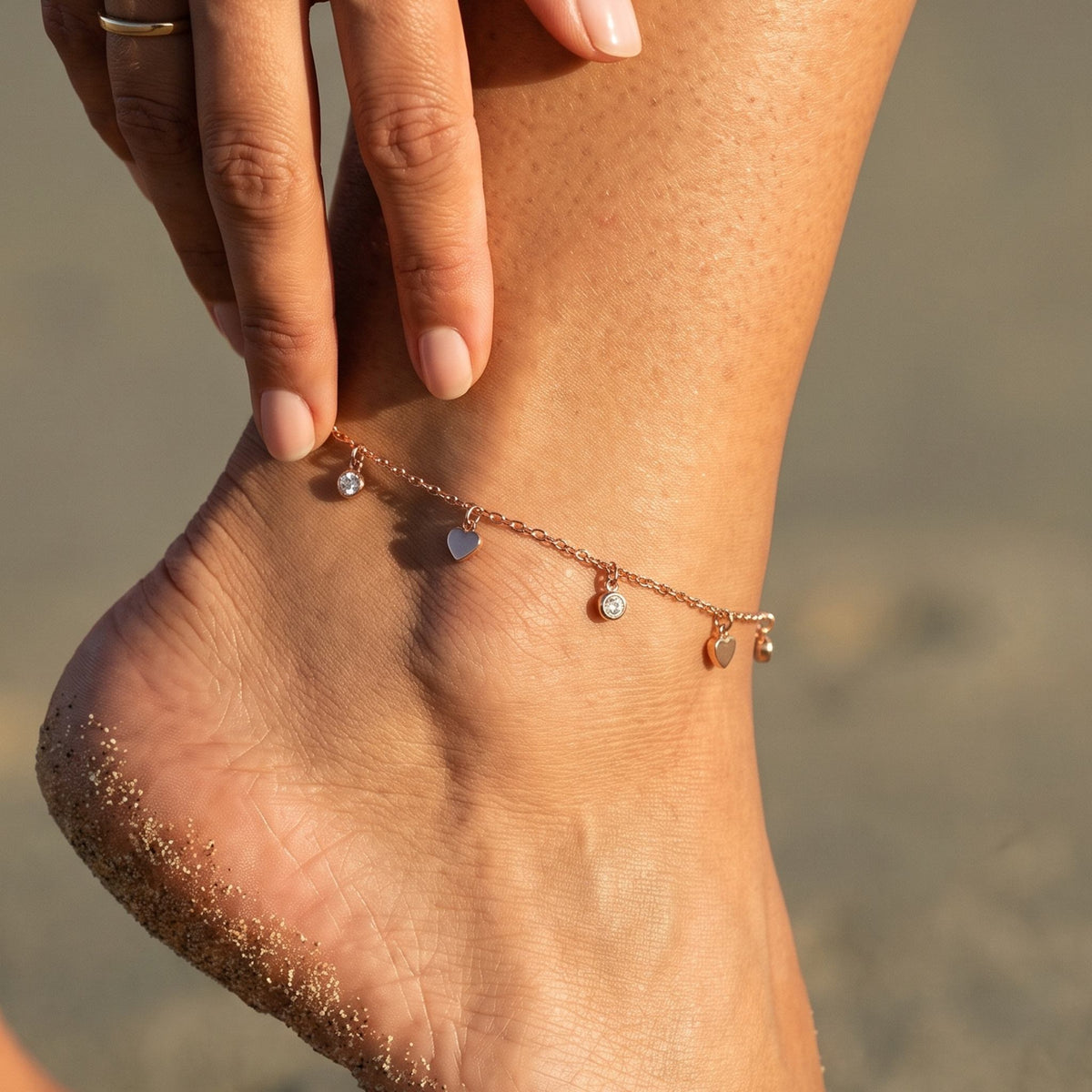 Close-up of the Sweetheart Anklet worn on the ankle