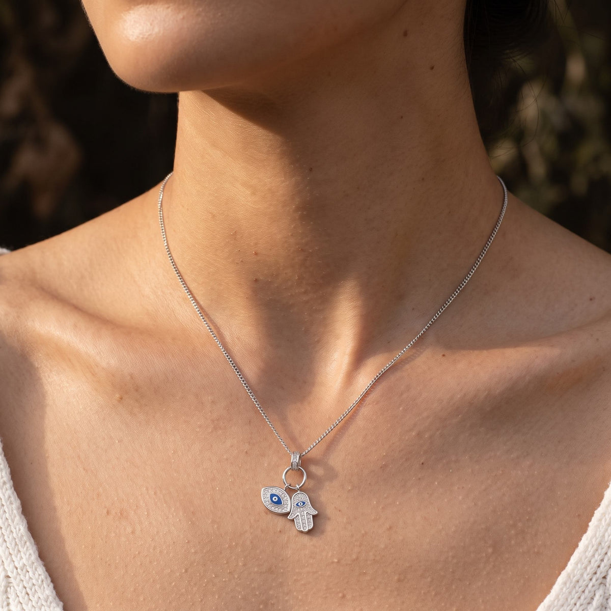 Woman wearing the Talisman Pendant on the neckline