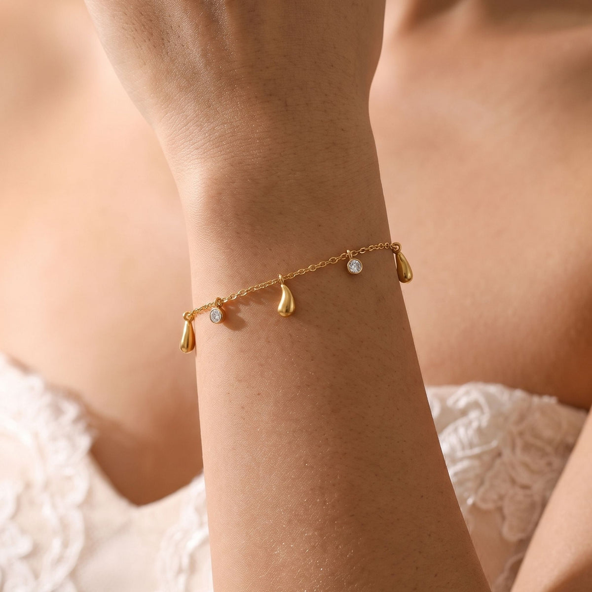 Teardrop Charm Bracelet worn on the wrist, photographed in natural daylight.
