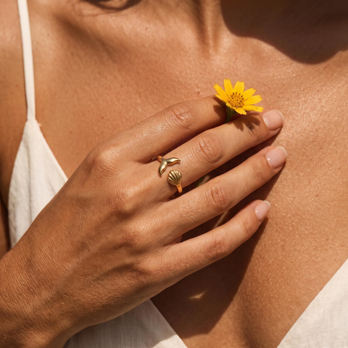 Wider view of a hand wearing the Tideline Ring