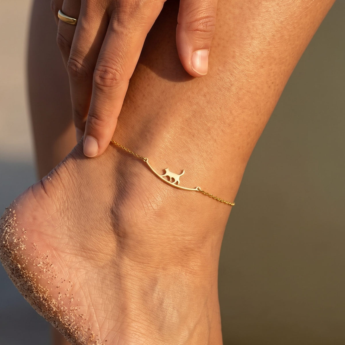 Close-up of the Walking Cat Anklet worn on the ankle