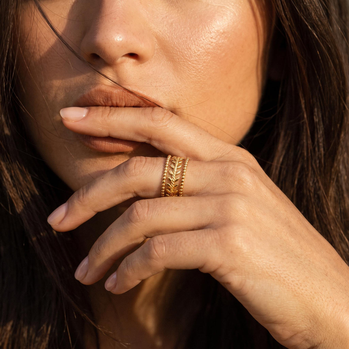 Wider view of a hand wearing the Wheat Leaf Ring