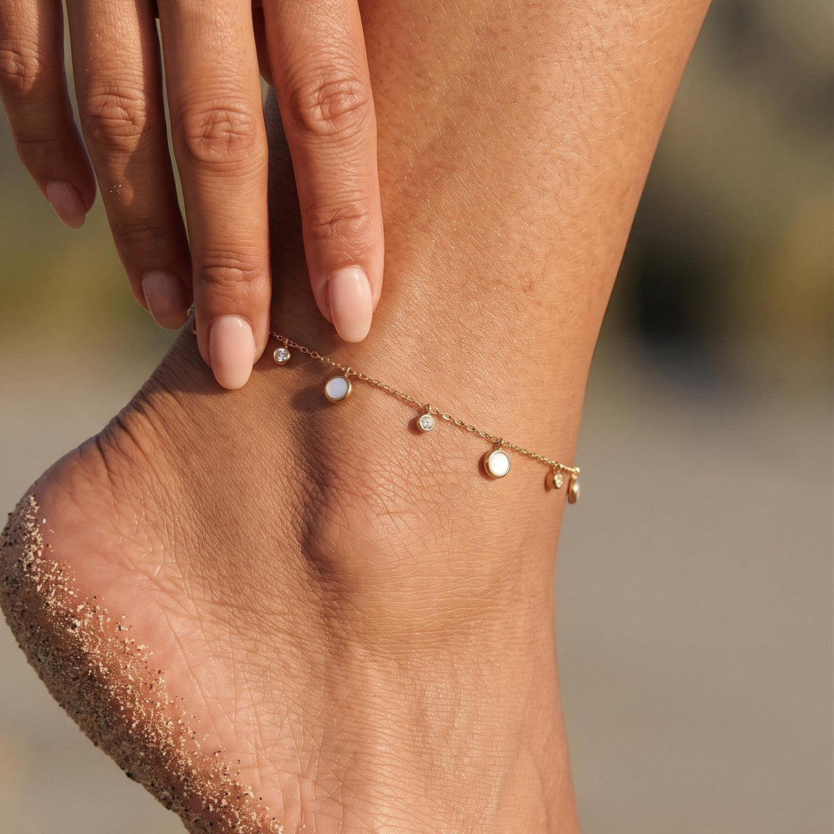Close-up of the White Shell Anklet worn on the ankle