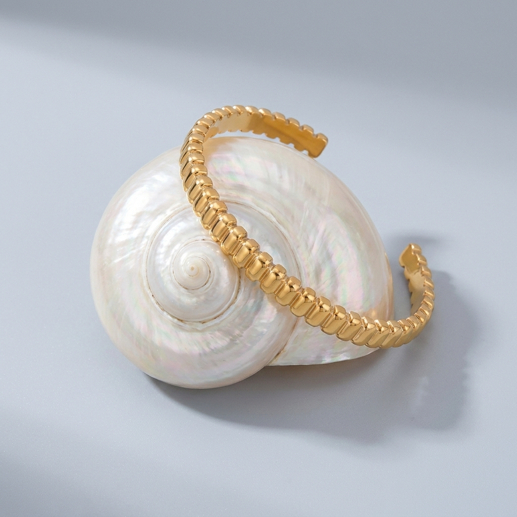 Emma Sculpted Gold Bangle with sparkling zircon details