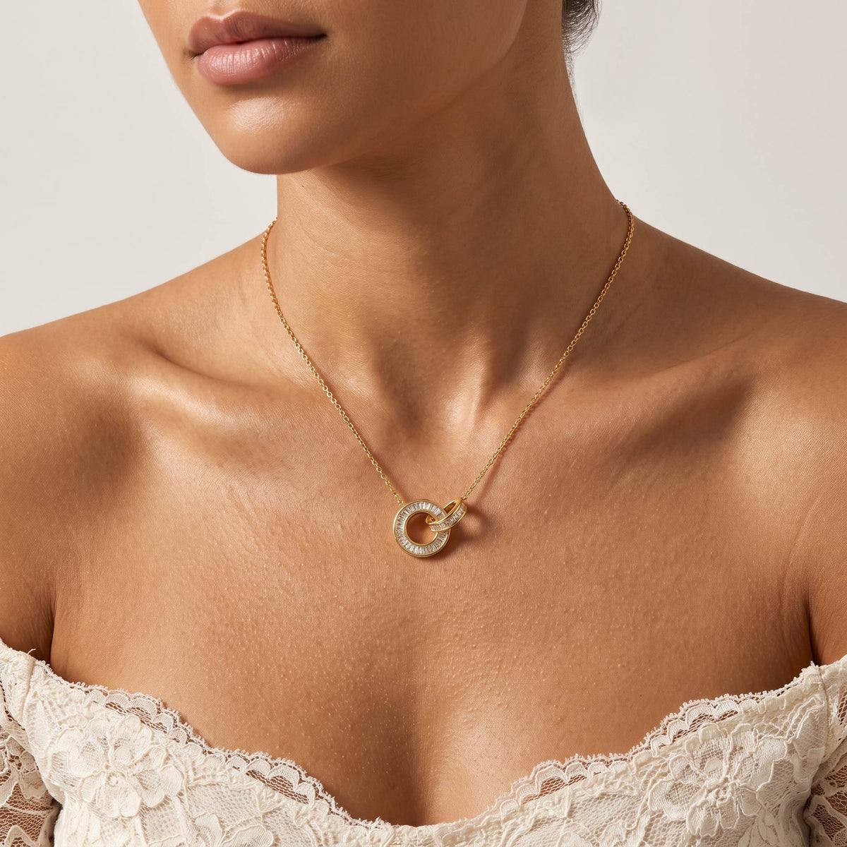 Woman wearing the Baguette Circle Necklace on the neckline