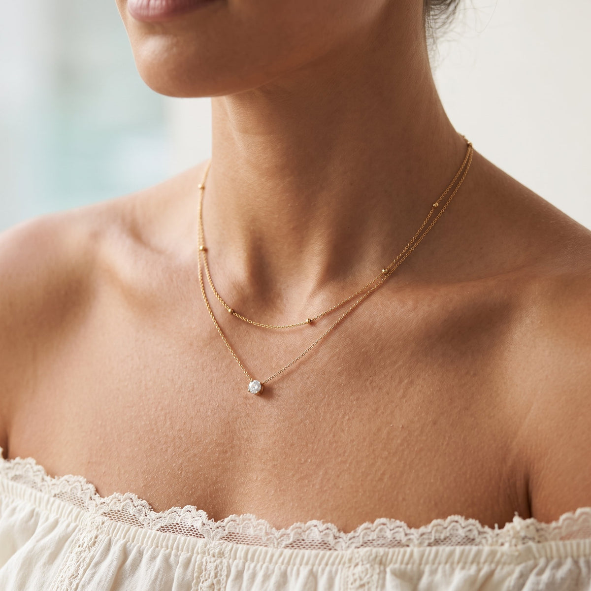 Wider view of a woman wearing the Beaded Layer Necklace