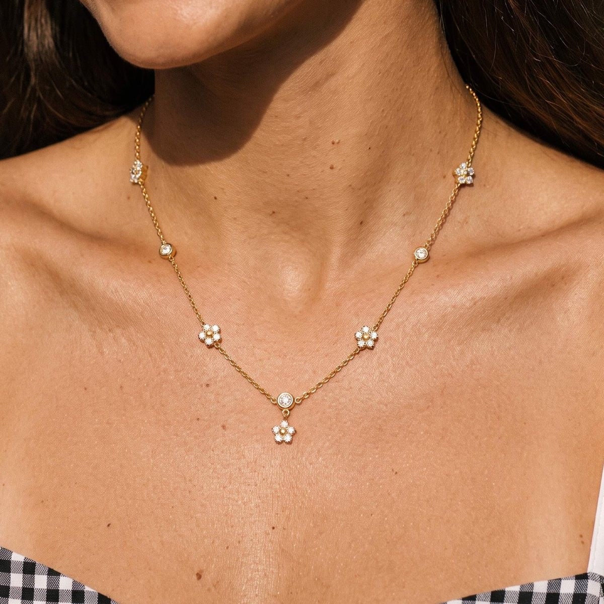 Close-up of the Blossom Chain Necklace worn on the neckline