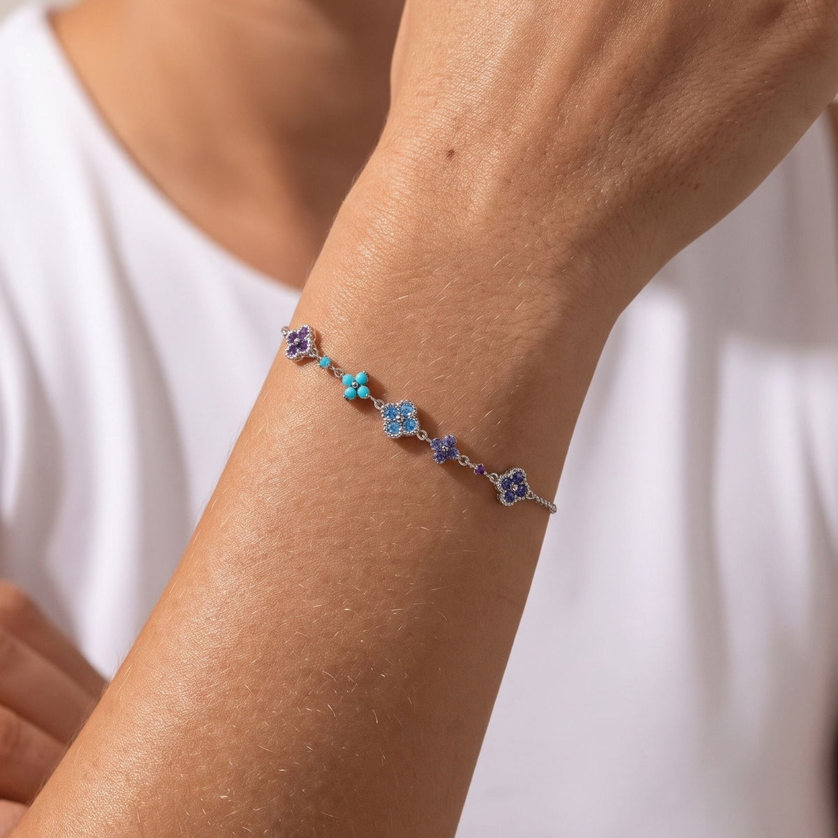 Blue Cluster Bracelet worn on the wrist, photographed in natural daylight.