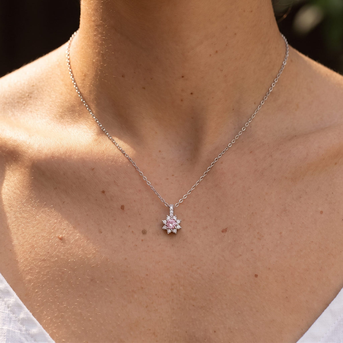 Close-up of the Blush Centre Pendant worn on the neckline