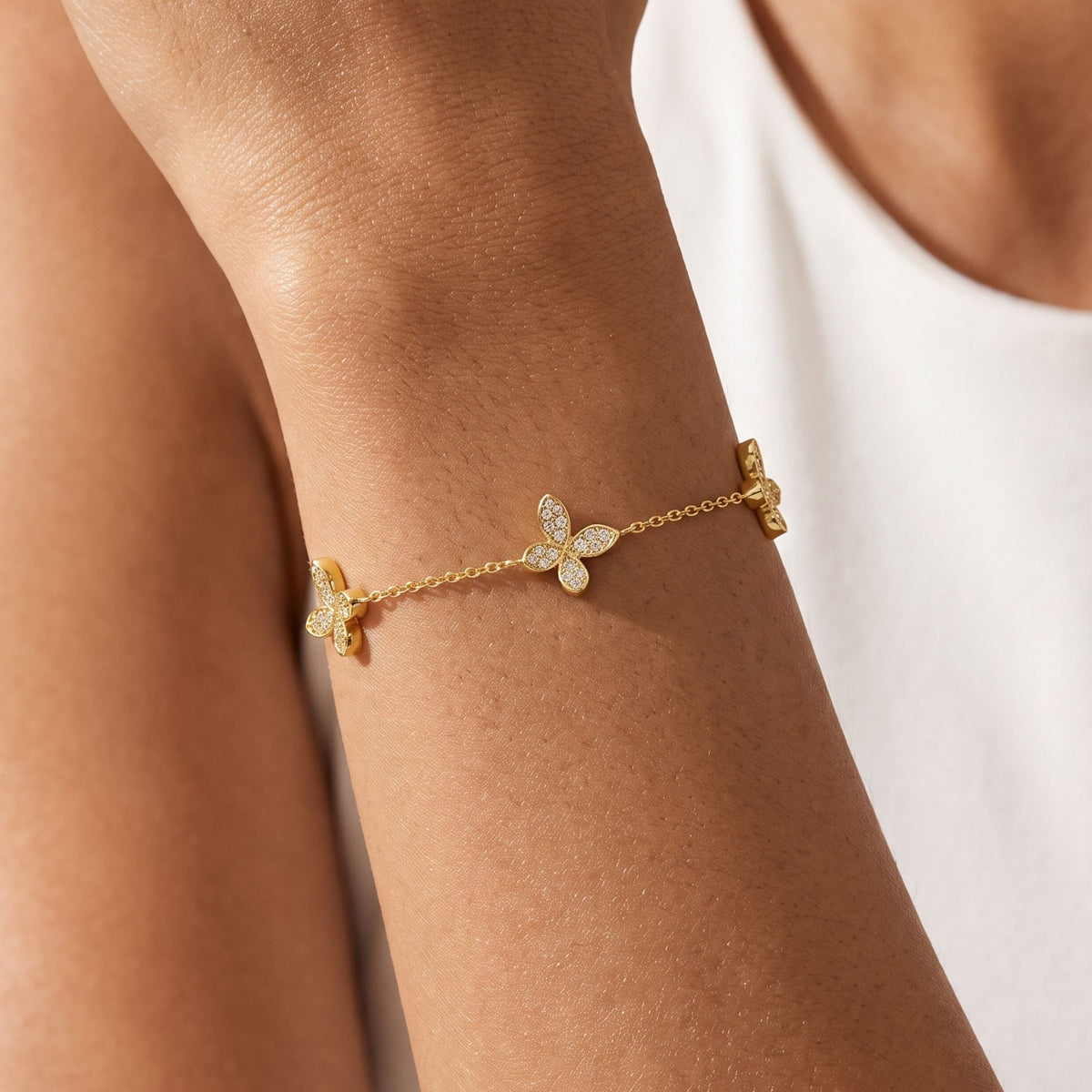 Butterfly Trio Bracelet worn on the wrist, photographed in natural daylight.