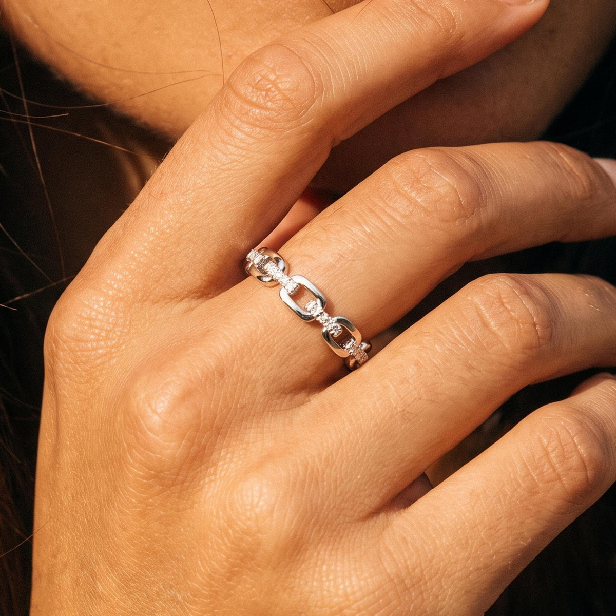 Close-up of the Cable Link Ring worn on the finger
