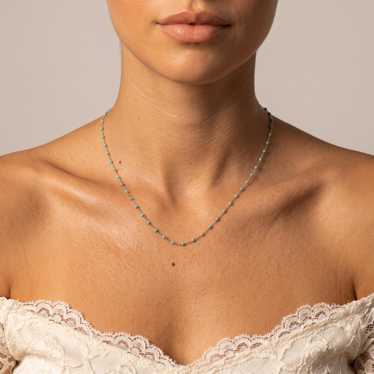 Wider view of a woman wearing the Capri Turquoise Necklace
