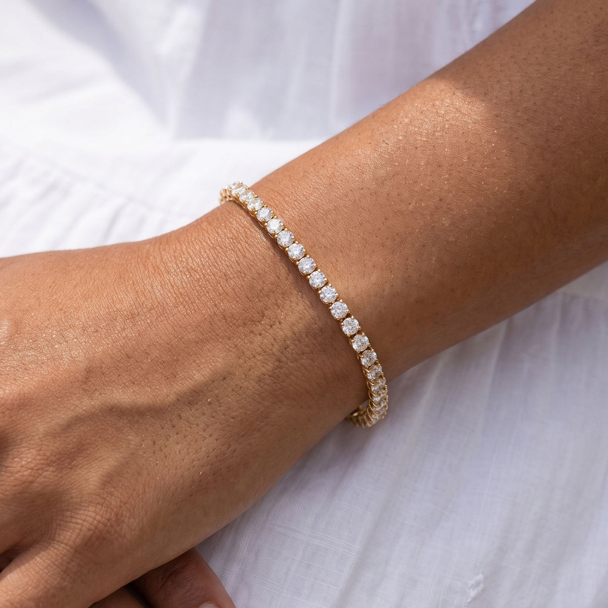 Classic Tennis Bracelet worn on the wrist, photographed in natural daylight.