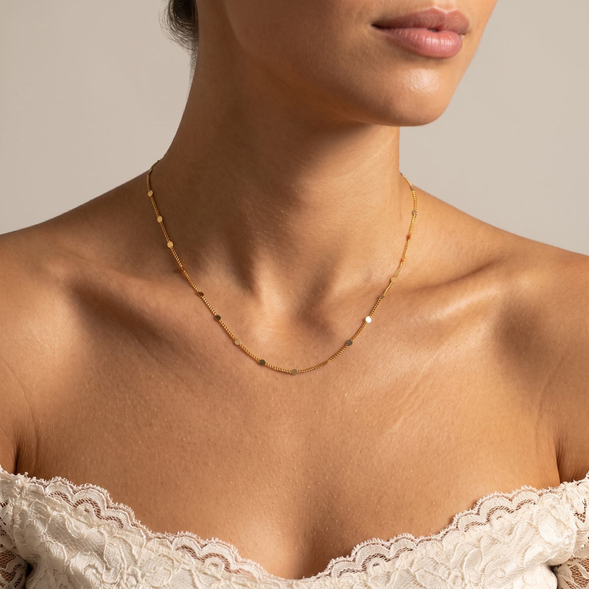 Wider view of a woman wearing the Confetti Necklace